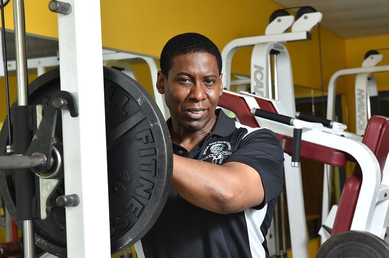 June 4, 2015 Fayetteville - Portrait of Bruce Davenport, 49, at his gym, Bruce's New World Fitness, in Fayetteville on Thursday, June 4, 2015. Bruce Davenport, 49, is all about good health. But the fitness center owner hadn't been able to afford health insurance until Obamacare came along. Now, he is concerned that he could lose his subsidy, essential for him as a small businessman. And, he wonders how it could be fair to take away subsidies but still mandate that people but insurance when they can't afford it. HYOSUB SHIN / HSHIN@AJC.COM