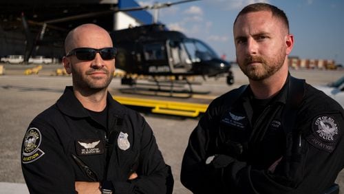 Atlanta police Officers Eric Lightkep (left) and William Treadwell were tagged with a laser recently while working crowd control in their helicopter.