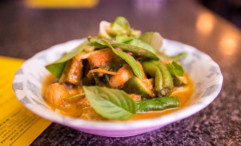  Talat Market serves a Thai red curry catfish with eggplant, rattlesnake beans, lime basil, ginger and pickled green tomatoes. / (Jenni Girtman/ Atlanta Event Photography)