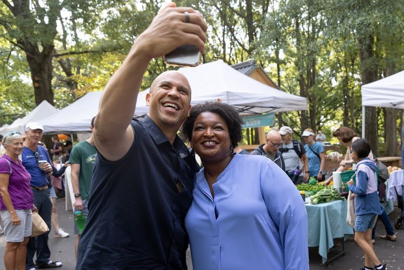  Stacey Abrams and New Jersey U.S. Sen. Cory Booker take a selfie during a campaign stop in September.  Steve Schaefer/steve.schaefer@ajc.com)
