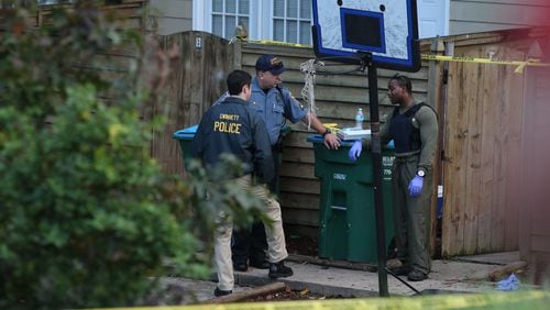 Gwinnett County police investigate a shooting that left three people dead and two injured Tuesday afternoon. (BEN GRAY / BGRAY@AJC.COM)