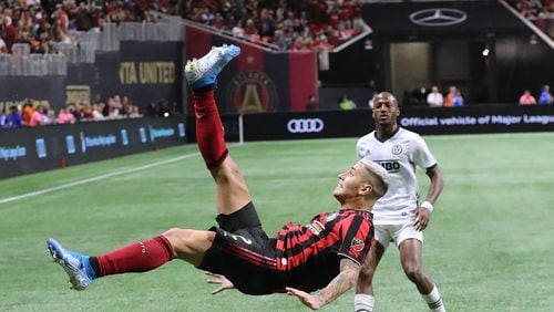 Atlanta United player Franco Escobar makes a bicycle kick pass to Josef Martinez against Philadelphia in the Eastern Conference semifinals of the MLS playoffs on Thursday, October 24, 2019, in Atlanta.   Curtis Compton/ccompton@ajc.com