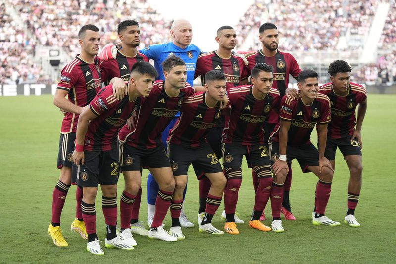 The Atlanta United starting lineup poses before a Leagues Cup soccer match against Inter Miami, Tuesday, July 25, 2023, in Fort Lauderdale, Fla. (AP Photo/Rebecca Blackwell)