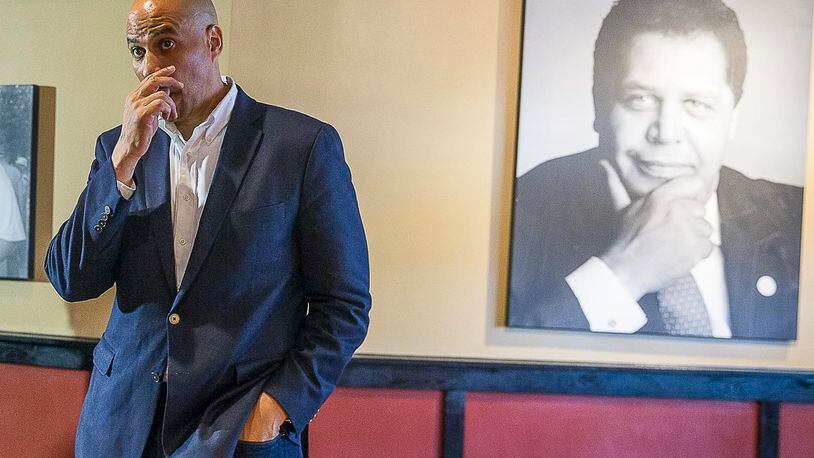 04/17/2019  -- Atlanta, Georgia -- A portrait of Atlanta's first black mayor, Maynard Jackson Jr., is displayed in the banquet room of Paschal's restaurant as U.S. Democrat Presidential hopeful Cory Booker takes a question during a campaign stop at the restaurant in Atlanta's Castleberry Hill community, Wednesday, April 17, 2019. (ALYSSA POINTER/ALYSSA.POINTER@AJC.COM)