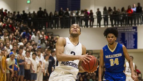 Norcross guard Kyle Sturdivant (3) goes to shoot the ball during the Boys Basketball quarterfinals playoff game between McEachern High and Norcross High at Norcross High School in Norcross, Georgia, on Wednesday, February 28, 2018. (REANN HUBER/REANN.HUBER@AJC.COM)