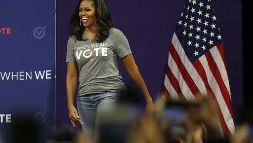 Former first lady Michelle Obama arrives on stage to speak during a When We All Vote rally in 2018. (Photo by Joe Raedle/Getty Images)