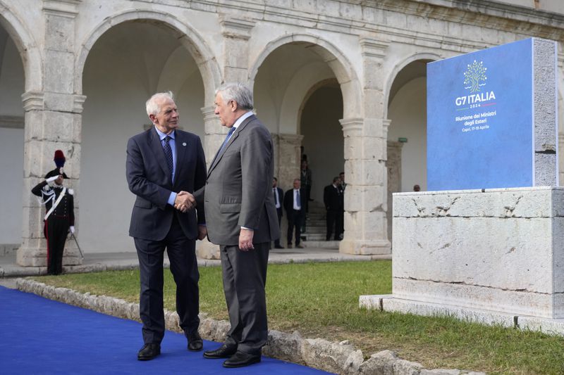 Italian Foreign Minister Antonio Tajani, right, welcomes European Union foreign policy chief Josep Borrell at the G7 Foreign Ministers meeting, on the Island of Capri, Italy, Wednesday, April 17, 2024. Group of Seven foreign ministers are meeting on the Italian resort island of Capri, with soaring tensions in the Mideast and Russia's continuing war in Ukraine topping the agenda. The meeting runs April 17-19. (AP Photo/Gregorio Borgia)