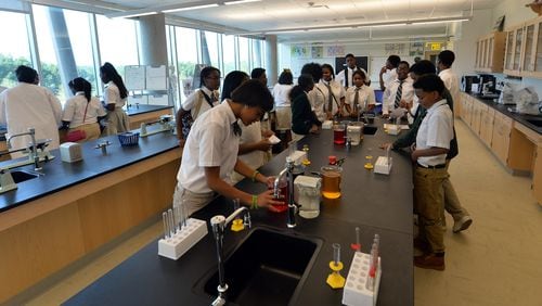 Students work in a biology lab at Charles R. Drew Charter School.
