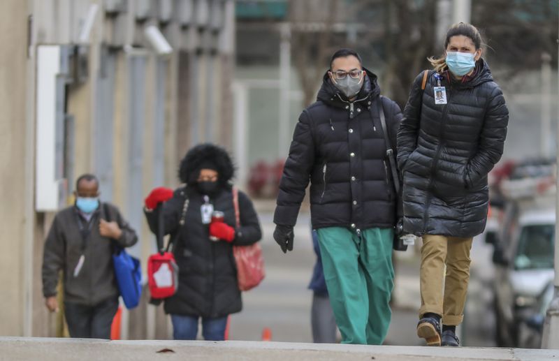 File photo of Grady Hospital healthcare workers arrive for work. (John Spink / John.Spink@ajc.com)

