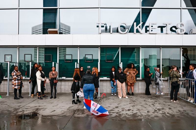 Fans wait outside of State Farm Arena to attend the memorial service for Migos rapper Takeoff on Friday, November 11, 2022. (Natrice Miller/natrice.miller@ajc.com)  