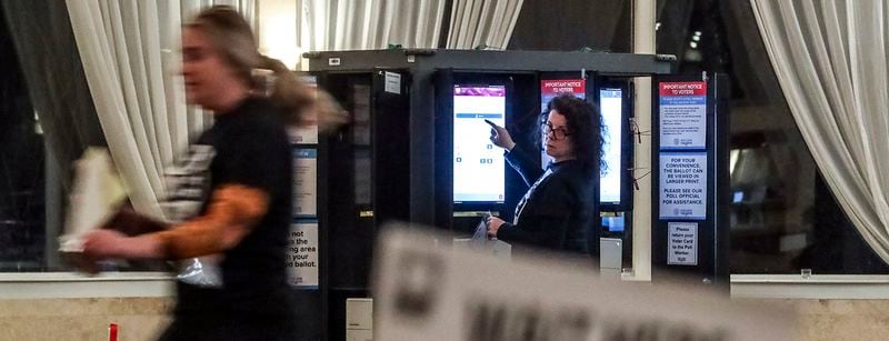 December 6, 2022 Atlanta: Poll manager, Alexandra Almeter (left) gets her precinct ready as poll worker, Sarah Zaslaw (right) gets the voting machines ready before the polls opened on Tuesday, Dec. 6, 2022 at the Park Tavern located at 500 10th Street NE in Atlanta. It‚Äôs been a marathon, not a sprint, for Georgia voters to settle on a long-term replacement for the late U.S. Sen. Johnny Isakson, who resigned from the Senate in 2019 amid ongoing health concerns. One gubernatorial appointment and five statewide elections later, Tuesday‚Äôs U.S. Senate runoff election in Georgia will finally decide who will represent Georgia in the Senate for a full, six-year term. In Walker‚Äôs final speech at the Governor‚Äôs Gun Club, he told a small crowd, ‚ÄúThe best thing I‚Äôve ever done, including the Heisman Trophy, and the Horatio Alger award, the best thing I‚Äôve ever done is run for office right here.‚Äù Late Monday night, Warnock Tweeted a final message. ‚ÄúI‚Äôve said it before and I‚Äôll say it again, I can‚Äôt have Herschel Walker representing my mama.‚Äù Most of the runoff polling put Warnock, the Democratic incumbent, slightly ahead of, but statistically tied with his Republican challenger. (John Spink / John.Spink@ajc.com)
