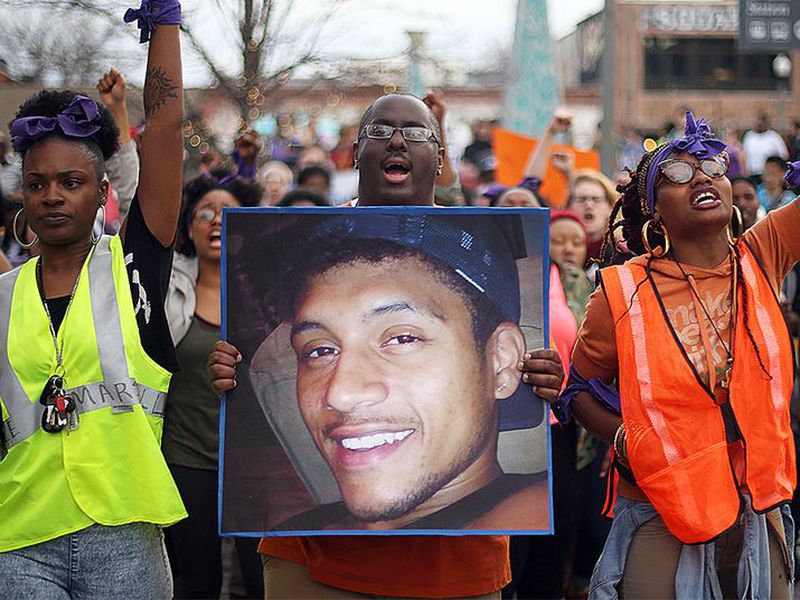 Activists protested the shooting of Anthony Hill, killed March 9 by a DeKalb County police officer who alleged the Afghanistan war veteran charged him in a threatening manner. BEN GRAY / BGRAY@AJC.COM