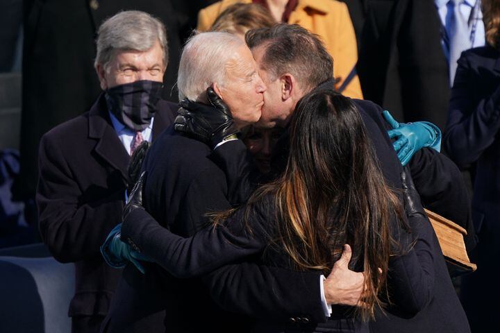 President Joe Biden is hugged his children, Hunter and Ashley, after he was sworn in at the Capitol in Washington on Wednesday, Jan. 20, 2021. (Erin Schaff/The New York Times)