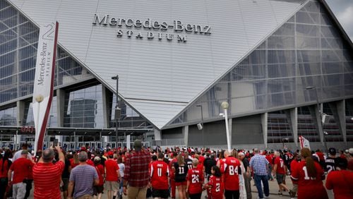 Fans enter the Mercedes-Benz Stadium, the new home of the Atlanta Falcons, before a pre-season game against the Arizona Cardinals, Saturday, Aug. 26, 2017, in Atlanta.  BRANDEN CAMP/SPECIAL