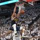 Denver Nuggets forward Aaron Gordon (50) dunks during the second half of Game 4 of an NBA basketball second-round playoff series against the Minnesota Timberwolves, Sunday, May 12, 2024, in Minneapolis. (AP Photo/Abbie Parr)