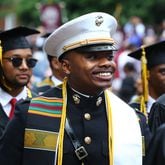 Graduates, including a newly commissioned officer, make their way toward the stage during the Morehouse College 138th Commencement Ceremony on Sunday, May 15, 2022, in Atlanta. Curtis Compton / Curtis.Compton@ajc.com