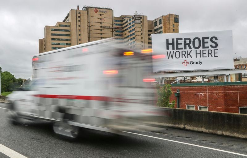 A large billboard visible to Southbound motorists traveling the I-75/I-85 connector states, "Heroes Work Here" referring to the medical workers of Grady Hospital. More and more signs and gestures of thanks to medical workers and first responders are evident across the city and state during the COVID-19 pandemic. Known coronavirus infections in Georgia are nearing 20,000 as the state moves closer to a scheduled end to a shelter-in-place mandate.  JOHN SPINK/JSPINK@AJC.COM