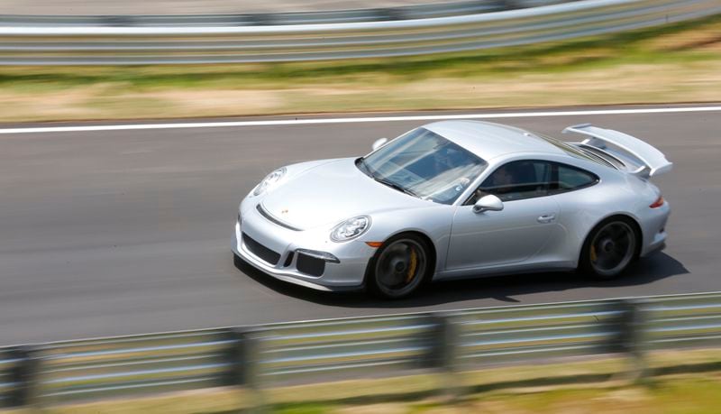  The Porsche Experience includes rides on their test track. BOB ANDRES / BANDRES@AJC.COM