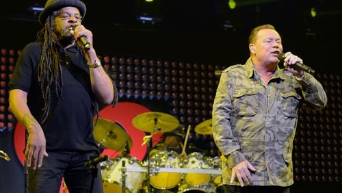 Musicians Astro, left, and Ali Campbell of UB40 perform on stage during the iHeart80s Party 2017 at SAP Center on Jan. 28, 2017, in San Jose.