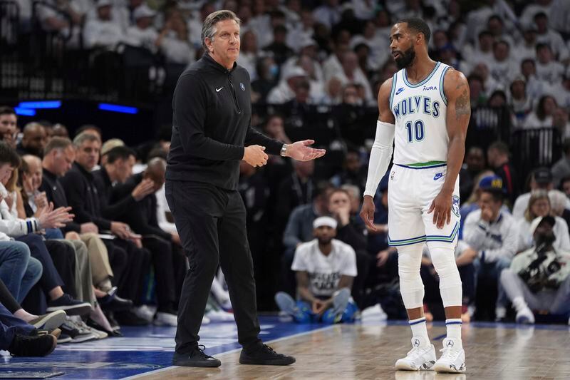 Minnesota Timberwolves head coach Chris Finch and guard Mike Conley (10) talk during the second half of Game 2 of an NBA basketball first-round playoff series against the Phoenix Suns, Tuesday, April 23, 2024, in Minneapolis. (AP Photo/Abbie Parr)