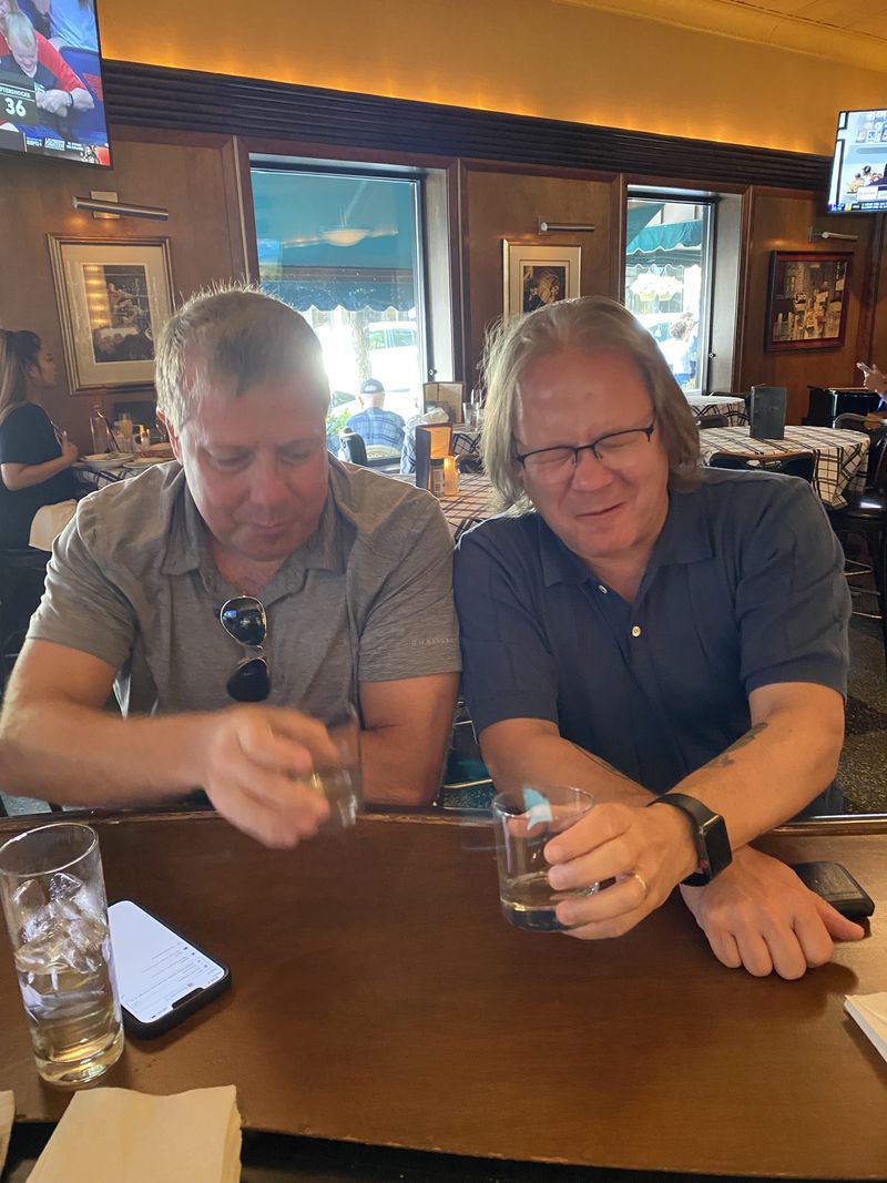 Jerry Slater (right) downs a shot of Jeppson's Malört with his friend Andrew Lewis. It has become a social media trend to post the reaction of a first taste of the astringent liqueur, along with the hashtag #malortface. Jerry Slater for The Atlanta Journal-Constitution