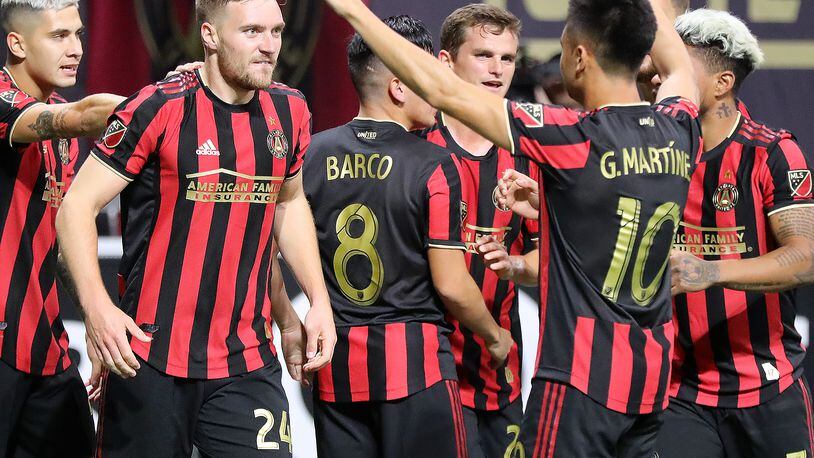 October 24, 2019 Atlanta: Atlanta United midfielder Julian Gressel (left) celebrates his goal against Philadelphia with Pity Martinez (right) and teammates to take a 1-0 lead in the Eastern Conference semifinals of the MLS playoffs on Thursday, October 24, 2019, in Atlanta.   Curtis Compton/ccompton@ajc.com
