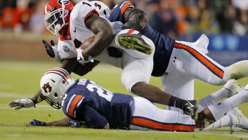 Georgia Bulldogs running back Sony Michel (1) struggles for a five yard run during the second half  UGA lost to Auburn in a NCAA college football game at Auburn 40-17.   BOB ANDRES  /BANDRES@AJC.COM