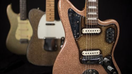 Among the collection at Songbirds Guitar Museum in Chattanooga, Tenn., is, (left to right) a 1963 Fender Stratocaster in Champagne Sparkle, a 1964 Fender Telecaster in Gold Sparkle and a 1966 Fender Jaguar in Pink Champagne Sparkle. CONTRIBUTED BY SONGBIRDS GUITAR MUSEUM