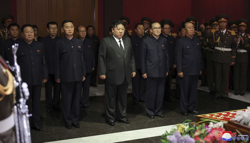 In this photo provided by the North Korean government, North Korean leader Kim Jong Un, front center, with top officials pays a condolence visit to the body of Kim Ki Nam, former secretary of the Central Committee of the Workers' Party of Korea at a funeral hall in Pyongyang, North Korea Wednesday, May 8, 2024. Independent journalists were not given access to cover the event depicted in this image distributed by the North Korean government. The content of this image is as provided and cannot be independently verified. Korean language watermark on image as provided by source reads: "KCNA" which is the abbreviation for Korean Central News Agency. (Korean Central News Agency/Korea News Service via AP)