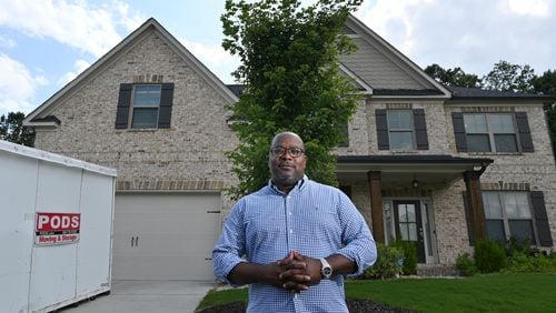 July 15, 2021 Lawrenceville - Portrait of Lavell Hewitt, a new homeowner who was lucky enough to score a home after selling his house to Opendoor at a higher than market price, outside his new home in Lawrenceville on Thursday, July 15, 2021. (Hyosub Shin / Hyosub.Shin@ajc.com)