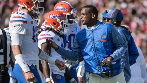 In this Nov. 11, 2017 file photo, Florida head coach Randy Shannon talks with quarterback Feleipe Franks (13) during the first half of an NCAA college football game  in Columbia, S.C.    Florida has little left to play for this season. Championship dreams are long gone. Bowl hopes are squashed. Even a .500 season is out the window. So whatâs left? The Gators (3-6) are playing for pride. They have two games remaining at home to at least end a miserable season on a positive note. It begins against bowl-eligible UAB (7-3) on Saturday, Nov. 18.(AP Photo/Sean Rayford, File)