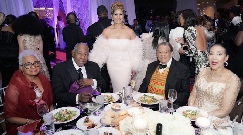 Billye and Hank Aaron and Andrew and Carolyn Young are shown at a past Mayor's Masked Ball. In the center is Justine Boyd, regional development director for the Atlanta region of UNCF. (Courtesy of UNCF)