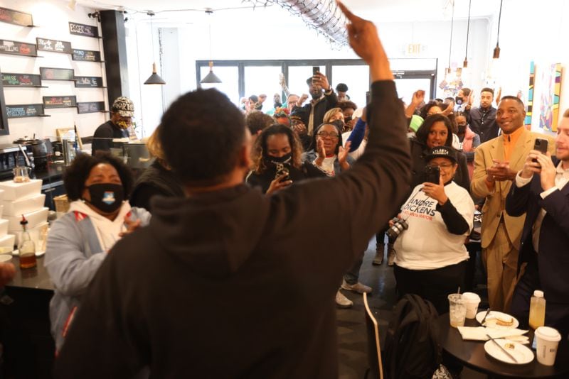 Supporters of Atlanta mayoral candidate Andre Dickens cheered as he finished his speech at Buzz Coffee and Winehouse on Saturday, November 20,  2021. Miguel Martinez for The Atlanta Journal-Constitution 