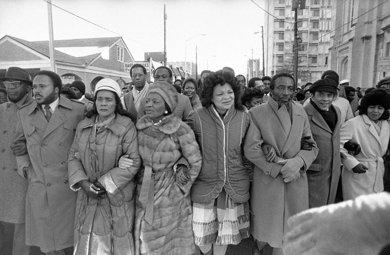 Arm in arm, Martin Luther King III, Coretta Scott King, Christine King Farris, Alveda King and Dick Gregory leader a march from the Ebenezer Baptist Church in Atlanta to the Federal building in honor of Martin Luther King Jr.’s birthday, Tuesday, Jan. 15, 1985. (AP Photo/Ric Reld)