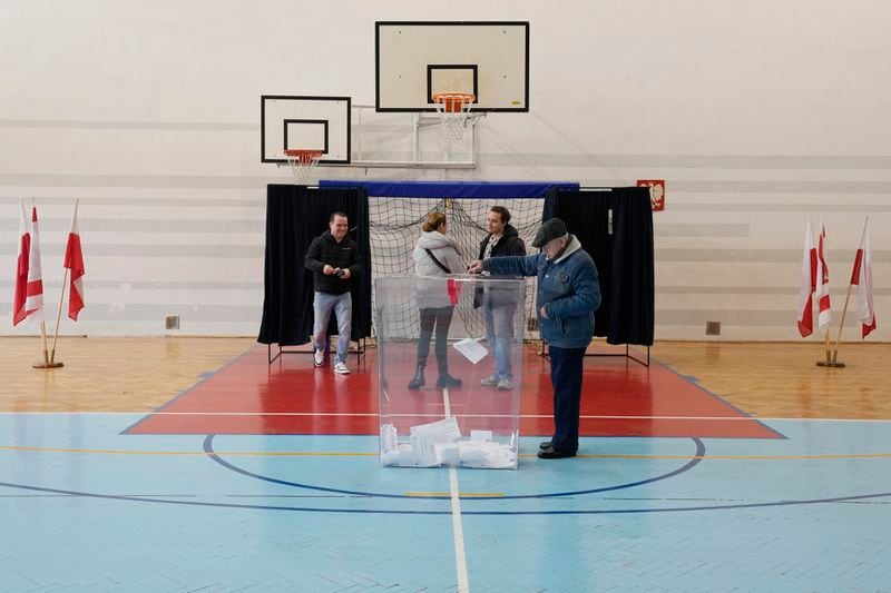 Polish voters take part in a local runoff election in Lomianki, near Warsaw, Poland on Sunday, April 21, 2024. Voters are choosing mayors who did not win outright in the first round of the election two weeks earlier. (AP Photo/Czarek Sokolowski)