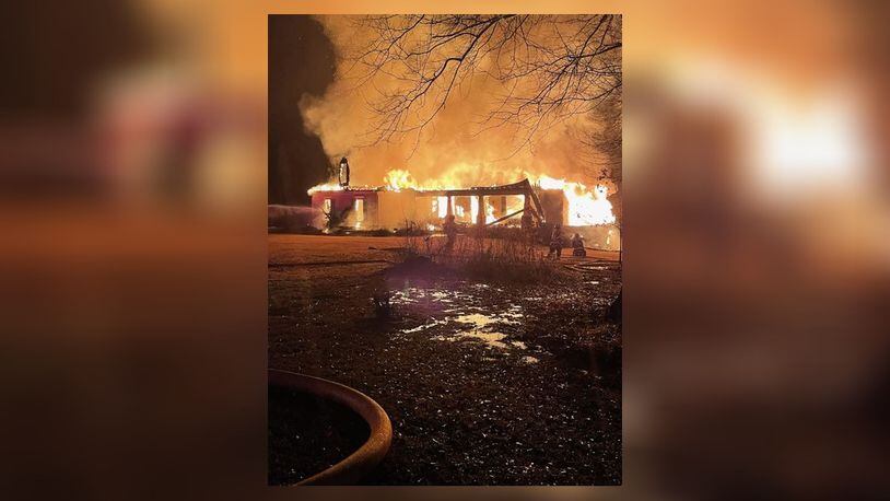 Flames engulfed a home in Cherokee County early Thursday and completely destroyed the single-story residence. (Credit: Cherokee County Fire and Emergency Services)