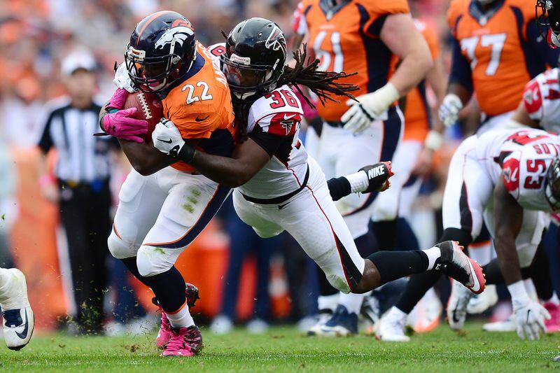 DENVER, CO - OCTOBER 9: Strong safety Kemal Ishmael #36 of the Atlanta Falcons tackles running back C.J. Anderson #22 of the Denver Broncos in the second half of the game at Sports Authority Field at Mile High on October 9, 2016 in Denver, Colorado. (Photo by Dustin Bradford/Getty Images)
