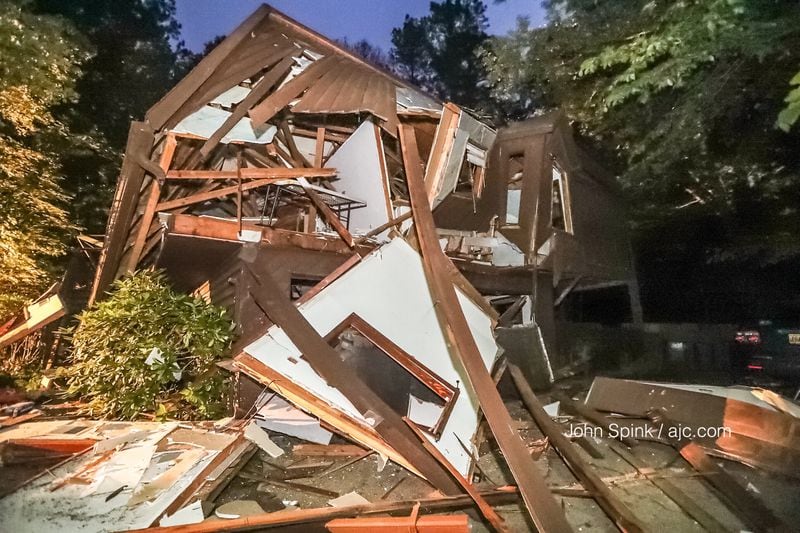 A house on Pine Grove Pointe Drive in Roswell was leveled when it exploded Tuesday night. Authorities are still investigating the cause of the explosion. JOHN SPINK / JSPINK@AJC.COM