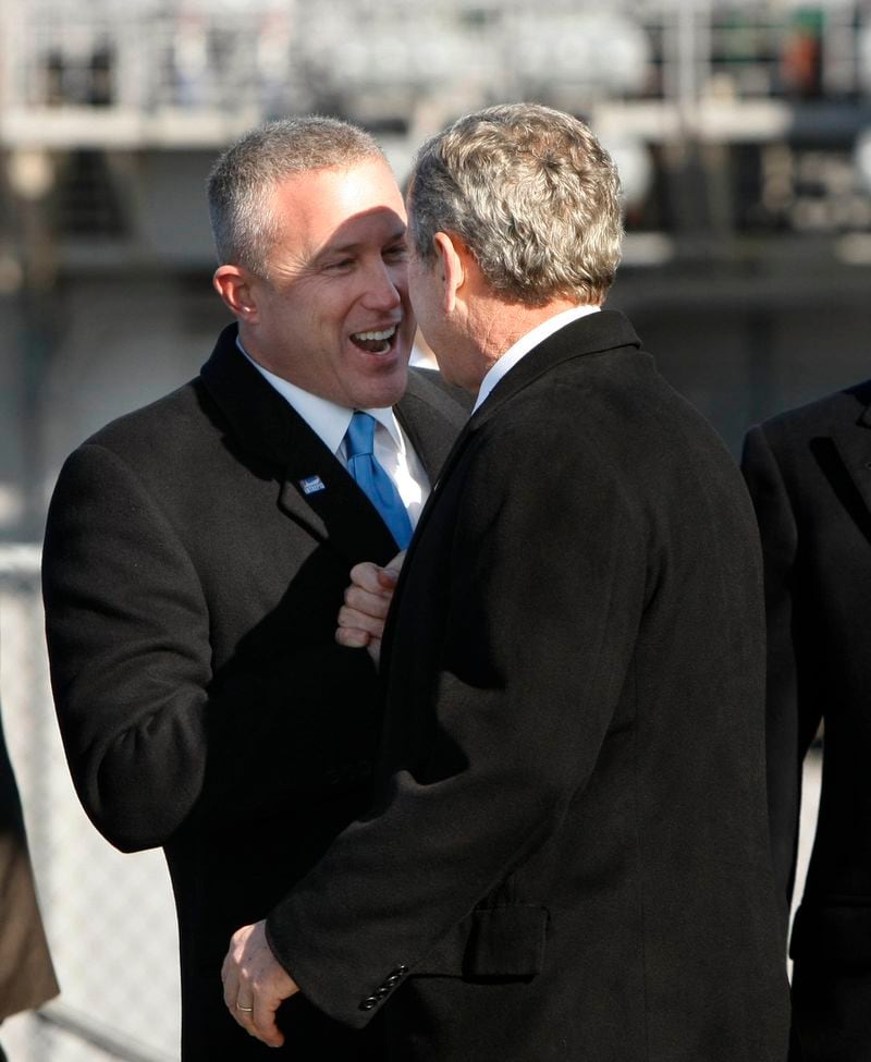 President George W. Bush is greeted by Bill White as he arrives to participate in the rededication ceremony of the Intrepid Sea, Air and Space Museum in New York in 2008. During White's time in charge of the museum, he built a Rolodex that rivaled any in New York. (Gerald Herbert / AP file)