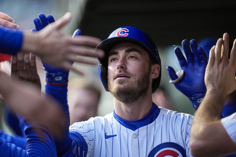 Chicago Cubs' Cody Bellinger celebrates after hitting a home run during the first inning of a baseball game against the Houston Astros, Tuesday, April 23, 2024, in Chicago. (AP Photo/Erin Hooley)