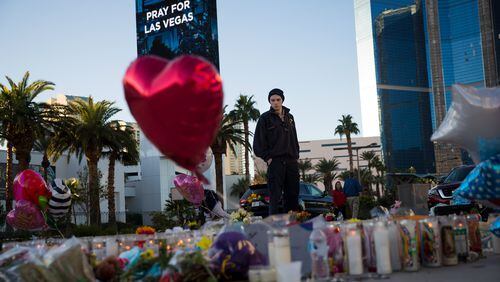 Matthew Helms, who worked as a medic the night of the shooting, visits a makeshift memorial for the victims of Sunday night's mass shooting, on the north end of the Las Vegas Strip, October 3, 2017 in Las Vegas, Nevada. (Photo by Drew Angerer/Getty Images)