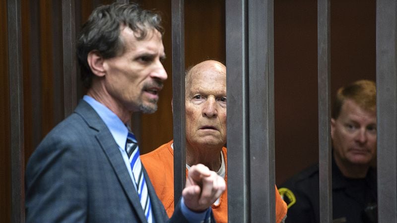 Joseph James DeAngelo Jr., center, listens as his attorney, Joe Cress, speaks in a Sacramento, California, courtroom on Tuesday, May 29, 2018. DeAngelo, a military veteran and former police officer, is accused of killing at least 13 people and raping more than 50 women as the Golden State Killer, a serial killer and rapist who is believed to have been active from 1975 to 1986.