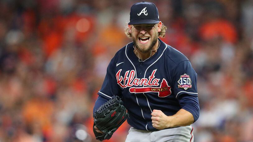 Braves reliever A.J Minter reacts to shutting down the Astros during the third inning after coming in for injured starter Charlie Morton in Game 1 of the World Series Tuesday, Oct. 26, 2021, in Houston.   (Curtis Compton / Curtis.Compton@ajc.com)