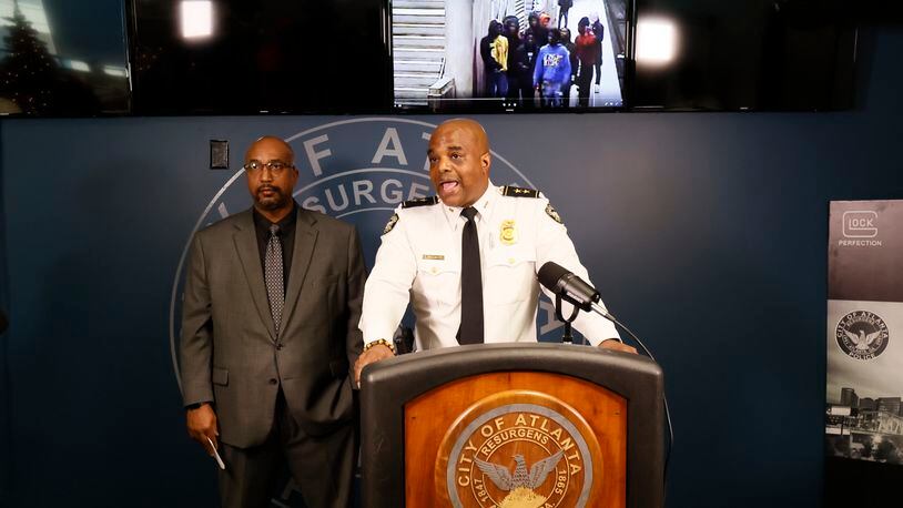 Atlanta Deputy Chief Charles Hampton Jr. and Detective Jarion Shephard speak during a press conference; they provide a video with the possible suspects and ask the community for help to identify them. According to investigators, a second child has died following a shooting on the 17th Street bridge. Miguel Martinez / miguel.martinezjimenez@ajc.com