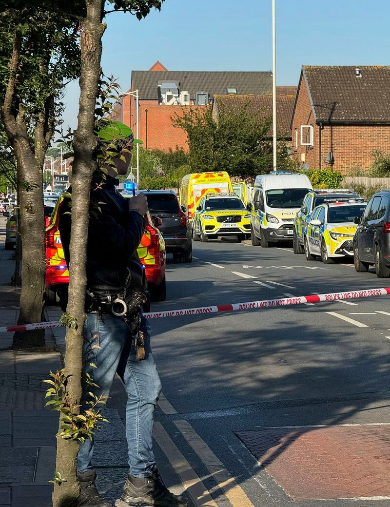 The area in London where police say a man wielding a sword attacked members of the public and two police officers on Tuesday, April 30, 2024 in the east London community of Hainault before being arrested. The incident is not being treated as terror-related. (Peter Kingdom via AP) MANDATORY CREDIT