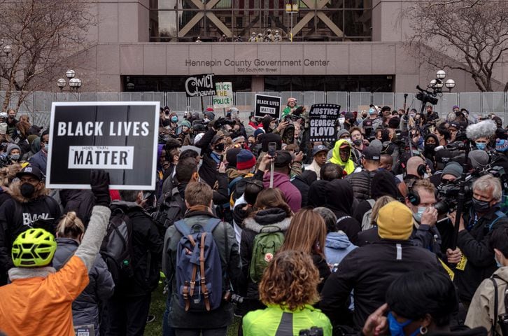 People gather outside the Hennepin Country Government Center in Minneapolis on Tuesday, April 20, 2021, as the jury prepares to deliver a verdict in the Derek Chauvin trial. (Amr Alfiky/The New York Times)