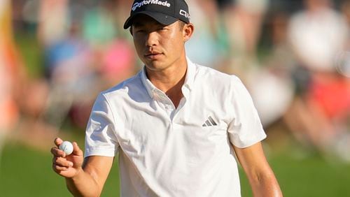 Collin Morikawa waves after making a putt on the 18th hole during the third round of the PGA Championship golf tournament at the Valhalla Golf Club, Saturday, May 18, 2024, in Louisville, Ky. (AP Photo/Sue Ogrocki)