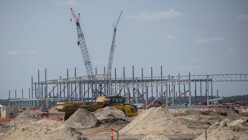 ELLABELL, GA. - JUNE 5, 2023: Large cranes and heavy earth-moving equipment work a construction site at the Hyundai Metaplant site, Monday, July 5, 2023, in Ellabell, Ga. (AJC Photo/Stephen B. Morton)
