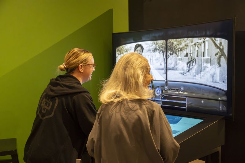 Curators at the Jimmy Carter Presidential Library and Museum in Atlanta, test a new exhibit that is part of "The Negro Motorist Green Book," exhibit which opens Saturday, March 30, 2024. (Olivia Bowdoin for the AJC).