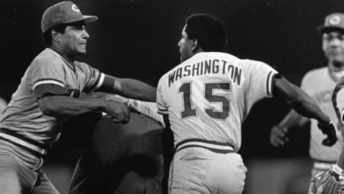 Braves outfielder Claudell Washington confronts a Reds player during a game in the 1980s.